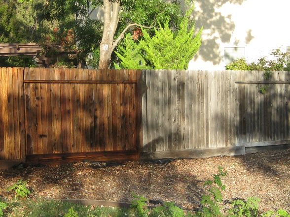wood fence before and after power wash and stain seal